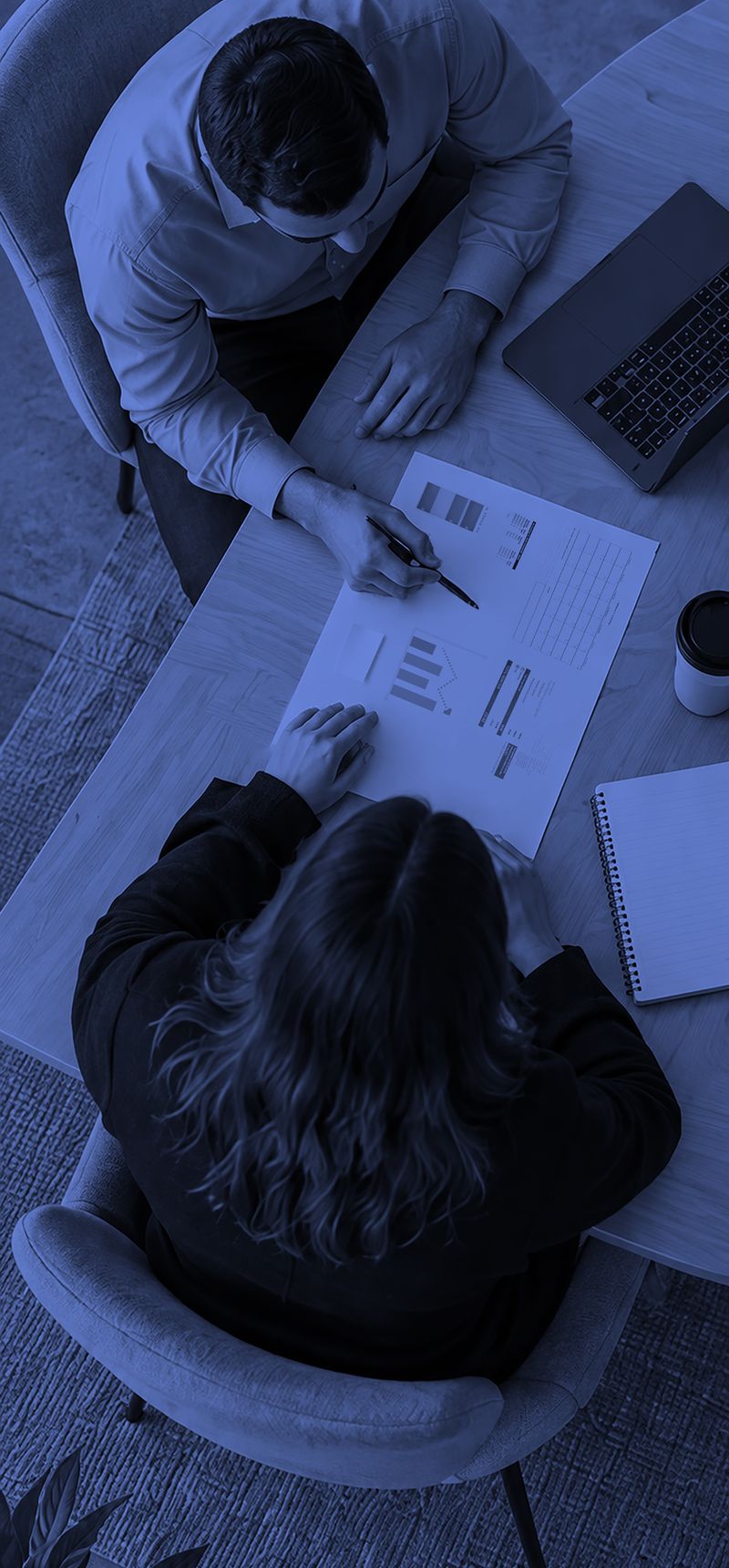 Accounting professionals reviewing reports together